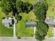 Bird's eye view of a home with large, well-kept yard, mature trees, and surrounding residential area at 324 Camellia Ave., Marion, SC 29571