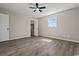 Bedroom with luxury vinyl plank flooring, ceiling fan, and a closet at 324 Camellia Ave., Marion, SC 29571