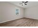 This bedroom offers a calm color palette with a window allowing for plenty of natural light at 324 Camellia Ave., Marion, SC 29571