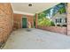 Covered carport featuring brick columns and ample space, providing convenient and stylish parking at 324 Camellia Ave., Marion, SC 29571