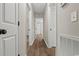 Hallway with updated floors, neutral paint, and streamlined doors at 324 Camellia Ave., Marion, SC 29571