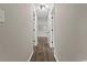 Hallway with luxury vinyl plank flooring and doorways leading to other rooms at 324 Camellia Ave., Marion, SC 29571