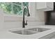 Close up of kitchen sink with modern black faucet and countertop at 324 Camellia Ave., Marion, SC 29571