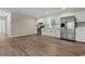 Open kitchen area featuring new stainless steel appliances and bright, white cabinets at 324 Camellia Ave., Marion, SC 29571