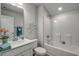 Clean bathroom with a shower/tub combo and a decorative wall mirror at 339 Garden Grove St, Conway, SC 29526