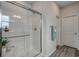 Modern bathroom with a glass-enclosed shower, white tiles, and contemporary fixtures at 339 Garden Grove St, Conway, SC 29526