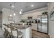 Bright kitchen with granite countertops, stainless steel appliances, and a breakfast bar with seating at 339 Garden Grove St, Conway, SC 29526