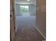 Bright living room with plush carpet and large window offering serene green views at 339 Garden Grove St, Conway, SC 29526
