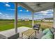 Relaxing covered porch with comfortable seating overlooking a spacious backyard at 339 Garden Grove St, Conway, SC 29526