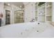 Spa tub with jacuzzi jets in a bright bathroom with tile flooring and a walk-in closet at 350 Saint Julian Ln., Myrtle Beach, SC 29579