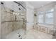 Elegant bathroom featuring a glass-enclosed shower and soaking tub with tile surround, exuding modern luxury at 350 Saint Julian Ln., Myrtle Beach, SC 29579