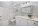 This bathroom features a shower-tub combination, white vanity, and a neutral color palette at 350 Saint Julian Ln., Myrtle Beach, SC 29579