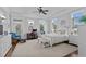 Bright bedroom with white furniture, a ceiling fan, a desk, and large windows offering natural light at 350 Saint Julian Ln., Myrtle Beach, SC 29579