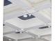 Detailed shot of the home's elegant, coffered ceiling design with recessed lighting and dark blue inlays at 350 Saint Julian Ln., Myrtle Beach, SC 29579