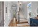 Bright hallway with hardwood floors and staircase leading to the upper level at 350 Saint Julian Ln., Myrtle Beach, SC 29579
