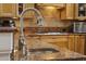 Close-up of modern kitchen with granite countertop and stainless steel faucet at 350 Saint Julian Ln., Myrtle Beach, SC 29579