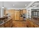 Spacious kitchen featuring custom cabinets, stainless steel appliances, and granite countertops at 350 Saint Julian Ln., Myrtle Beach, SC 29579