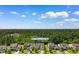 Aerial view of the home surrounded by lush greenery in a suburban neighborhood at 3647 Diamond Stars Way, Little River, SC 29566
