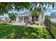 Beautiful backyard with patio, screened in porch, and lush green lawn at 3647 Diamond Stars Way, Little River, SC 29566