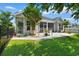 Beautiful backyard with patio, screened in porch, and green lawn at 3647 Diamond Stars Way, Little River, SC 29566