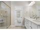 Elegant bathroom with double vanity, walk-in shower and neutral tones, perfect for a relaxing and functional space at 3647 Diamond Stars Way, Little River, SC 29566