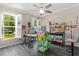 Bright craft room with natural light, ample workspace, storage, gray flooring and a ceiling fan at 3647 Diamond Stars Way, Little River, SC 29566