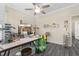 Spacious craft room with ample workspace, storage, gray flooring and a ceiling fan at 3647 Diamond Stars Way, Little River, SC 29566