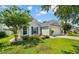 Well-maintained home with beautiful landscaping, lush green lawn, and a two-car attached garage at 3647 Diamond Stars Way, Little River, SC 29566