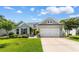 Charming single-story home featuring a well-manicured lawn and an attached two-car garage at 3647 Diamond Stars Way, Little River, SC 29566