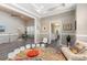 Open-concept living space with vaulted ceiling, modern seating, and seamless flow into the kitchen and other areas at 3647 Diamond Stars Way, Little River, SC 29566