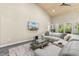 Cozy living room with a large sectional sofa, vaulted ceilings, and a wall-mounted TV for relaxing evenings at 3647 Diamond Stars Way, Little River, SC 29566
