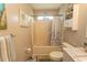 Cozy bathroom featuring a shower-tub combo, tiled floor, and beach-themed decorations at 3879 Mallard Way, Little River, SC 29566
