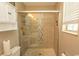 Updated bathroom with a glass shower enclosure, window, and cabinet storage at 3879 Mallard Way, Little River, SC 29566