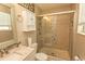 Bathroom with a glass-enclosed shower, granite vanity, and cabinet storage at 3879 Mallard Way, Little River, SC 29566