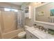 Bathroom with a tub-shower combo, granite countertop and stylish fixtures at 3879 Mallard Way, Little River, SC 29566
