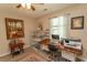 Bright bedroom featuring a functional workspace and natural light, complete with wood-look floors at 3879 Mallard Way, Little River, SC 29566