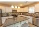 Modern kitchen featuring granite countertops, stainless steel appliances, and white cabinets at 3879 Mallard Way, Little River, SC 29566