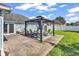 Backyard features a patio with a gazebo, seating, and a well-maintained lawn at 3907 Stillwood Dr., Myrtle Beach, SC 29588