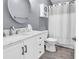 Modern bathroom features white cabinetry, marble countertops, and updated fixtures at 3907 Stillwood Dr., Myrtle Beach, SC 29588