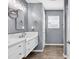 Bathroom with double sink vanity, marble countertop and tile floor at 3907 Stillwood Dr., Myrtle Beach, SC 29588