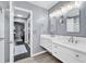 Bathroom featuring a double vanity, marble countertops, and open doorway at 3907 Stillwood Dr., Myrtle Beach, SC 29588