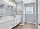 Bathroom with double sink vanity, marble countertop and tile floor at 3907 Stillwood Dr., Myrtle Beach, SC 29588