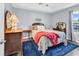 Comfortable bedroom features neutral tones, ample natural light, and stylish furnishings at 3907 Stillwood Dr., Myrtle Beach, SC 29588