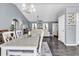 Open dining area with access to living room and kitchen, featuring a modern chandelier at 3907 Stillwood Dr., Myrtle Beach, SC 29588