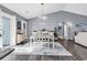 Bright dining room with modern decor, stylish lighting, and access to outdoor space at 3907 Stillwood Dr., Myrtle Beach, SC 29588