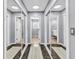 Hallway view with mirror closet doors reflecting interior doors at 3907 Stillwood Dr., Myrtle Beach, SC 29588