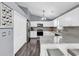 Modern kitchen with white cabinets, granite countertops, stainless steel appliances, and hardwood floors at 3907 Stillwood Dr., Myrtle Beach, SC 29588