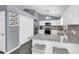 Modern kitchen with white cabinets, granite countertops, stainless steel appliances and a breakfast bar at 3907 Stillwood Dr., Myrtle Beach, SC 29588