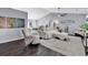 Open living room with vaulted ceilings, hardwood floors, and neutral-toned furniture at 3907 Stillwood Dr., Myrtle Beach, SC 29588