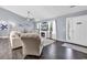 Bright living room featuring a fireplace, TV, hardwood floors, and lots of natural light at 3907 Stillwood Dr., Myrtle Beach, SC 29588